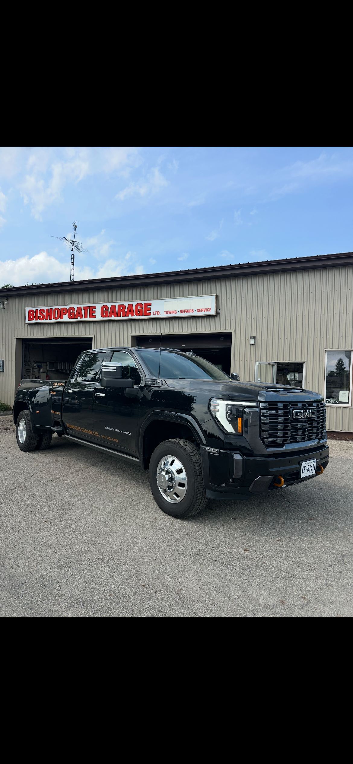 Bishopgate Garage shop front with truck out front, Burford, Ontario