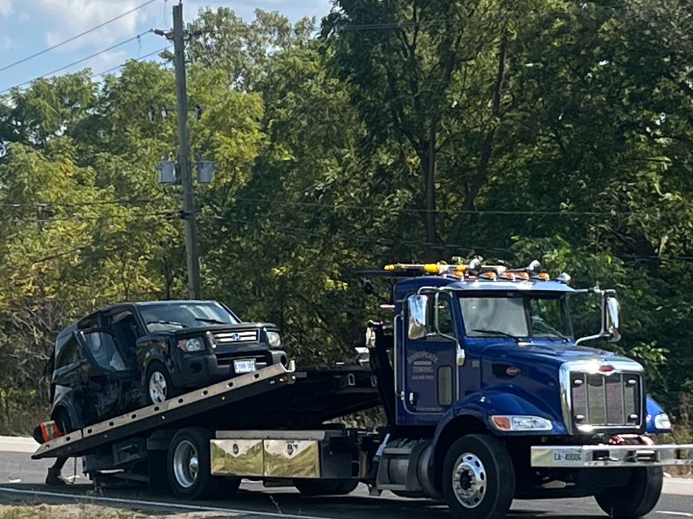 Bishopgate flatbed recovering a vehicle after a collision on the roadside