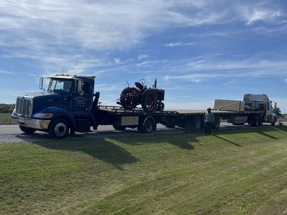 Bishopgate flatbed transporting a vintage tractor
